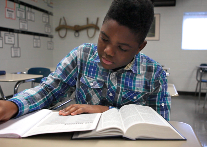 a student, reading his bible