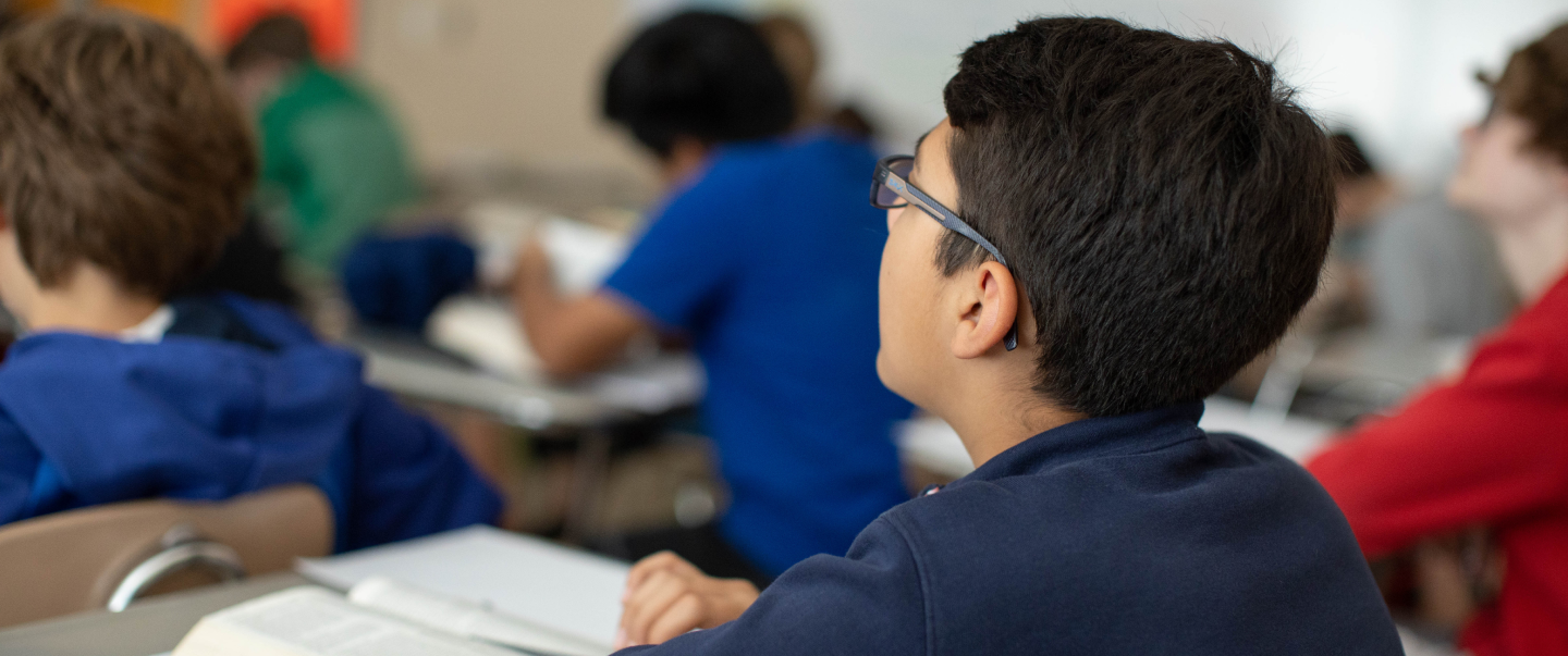 a student attentively listening to the lessons