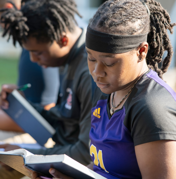 students reading their bible