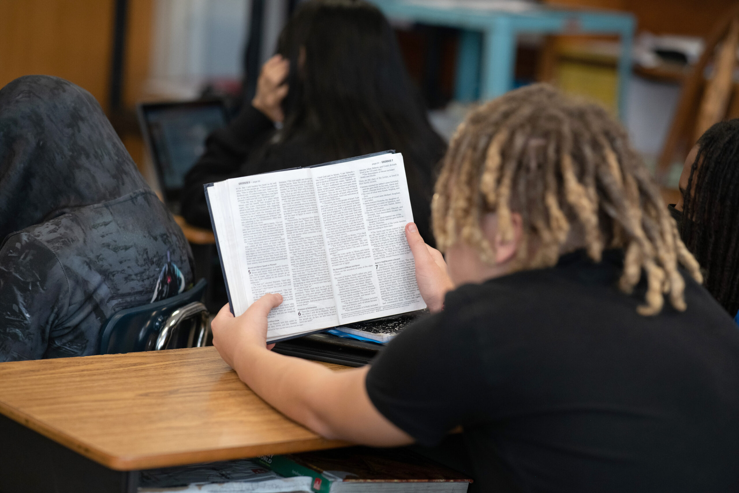 a student studying a bible