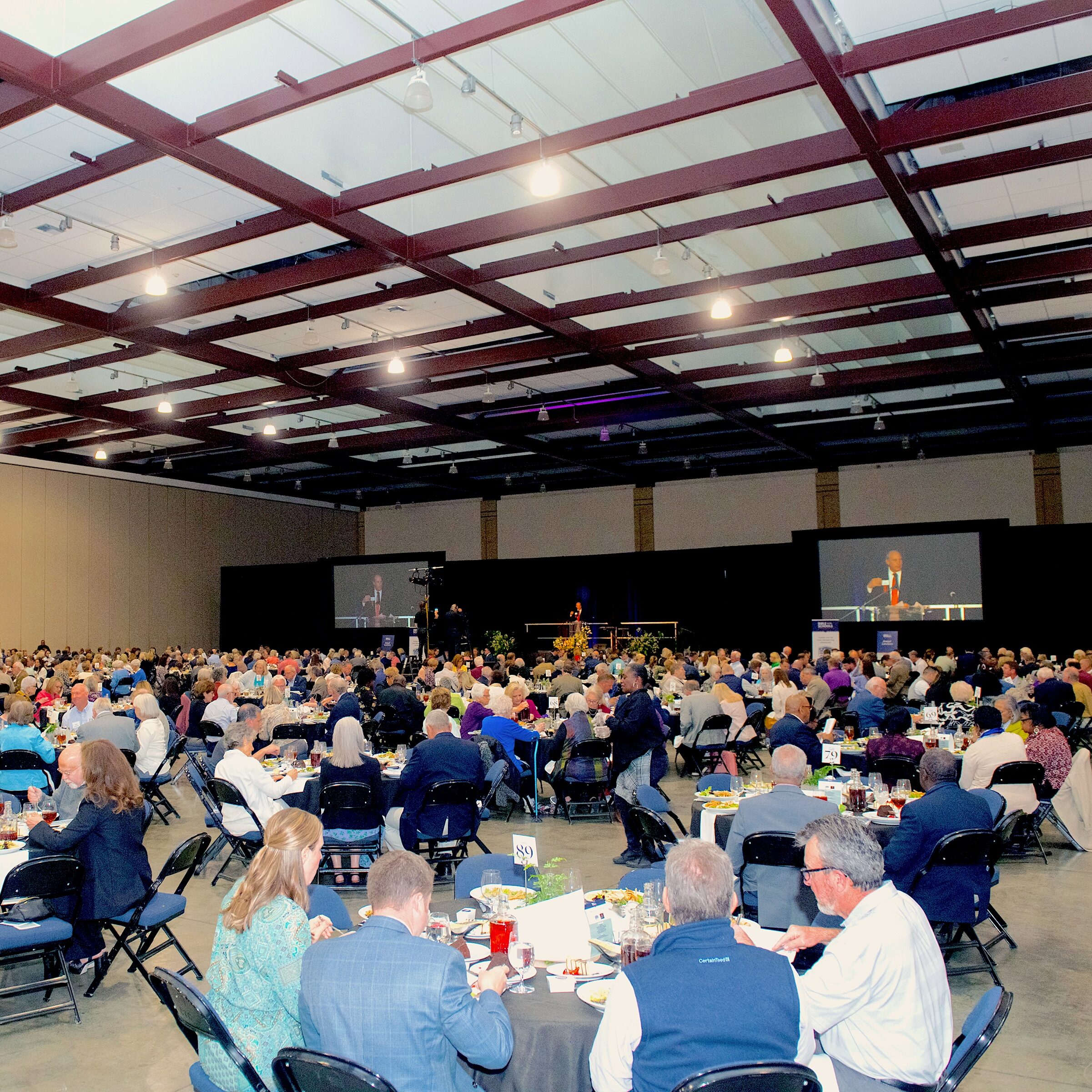 Hundreds of participants sitting around tables during the Bible in The Schools Annual Luncheon